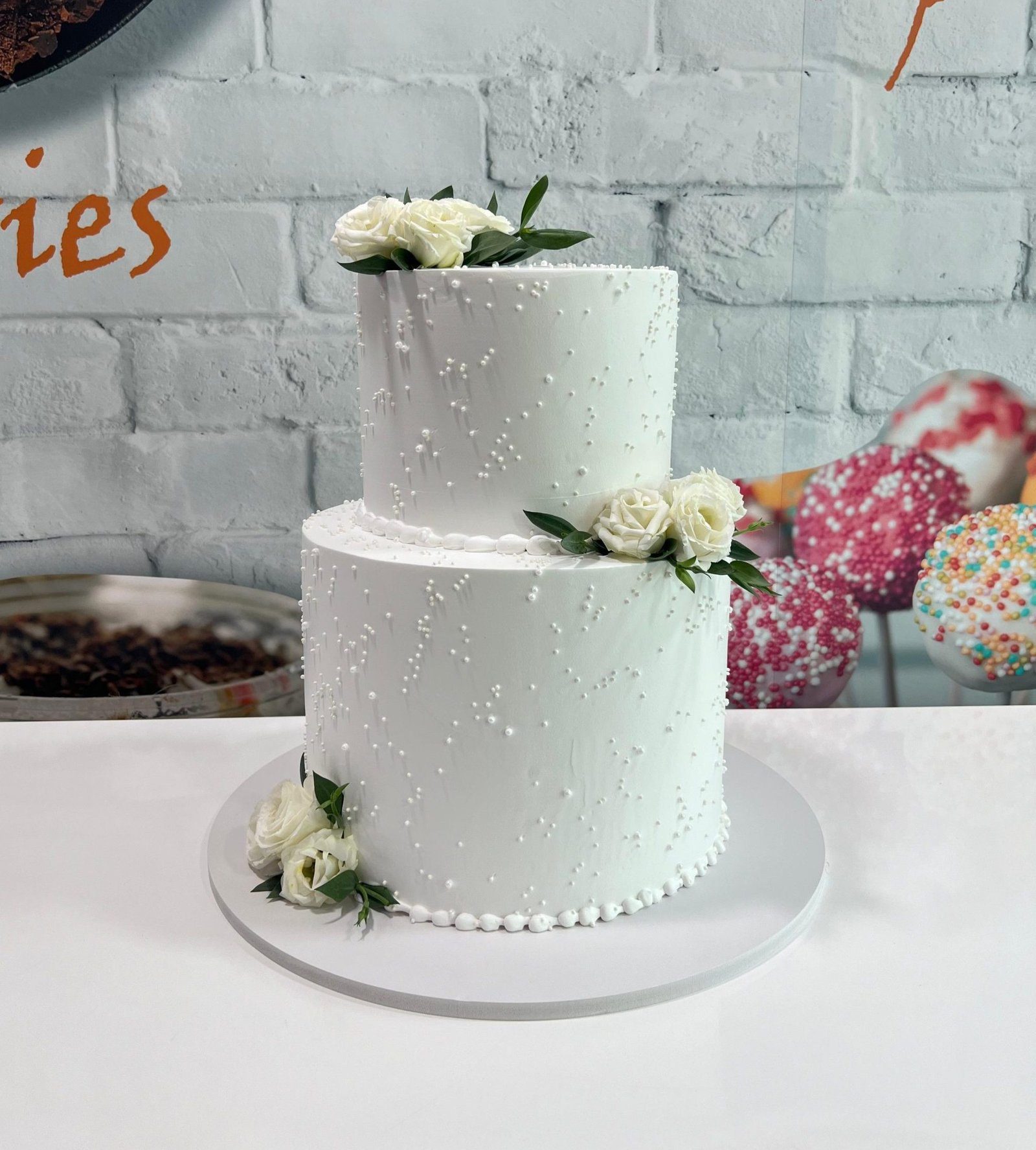 Elegant White Floral Two-Tier Cake