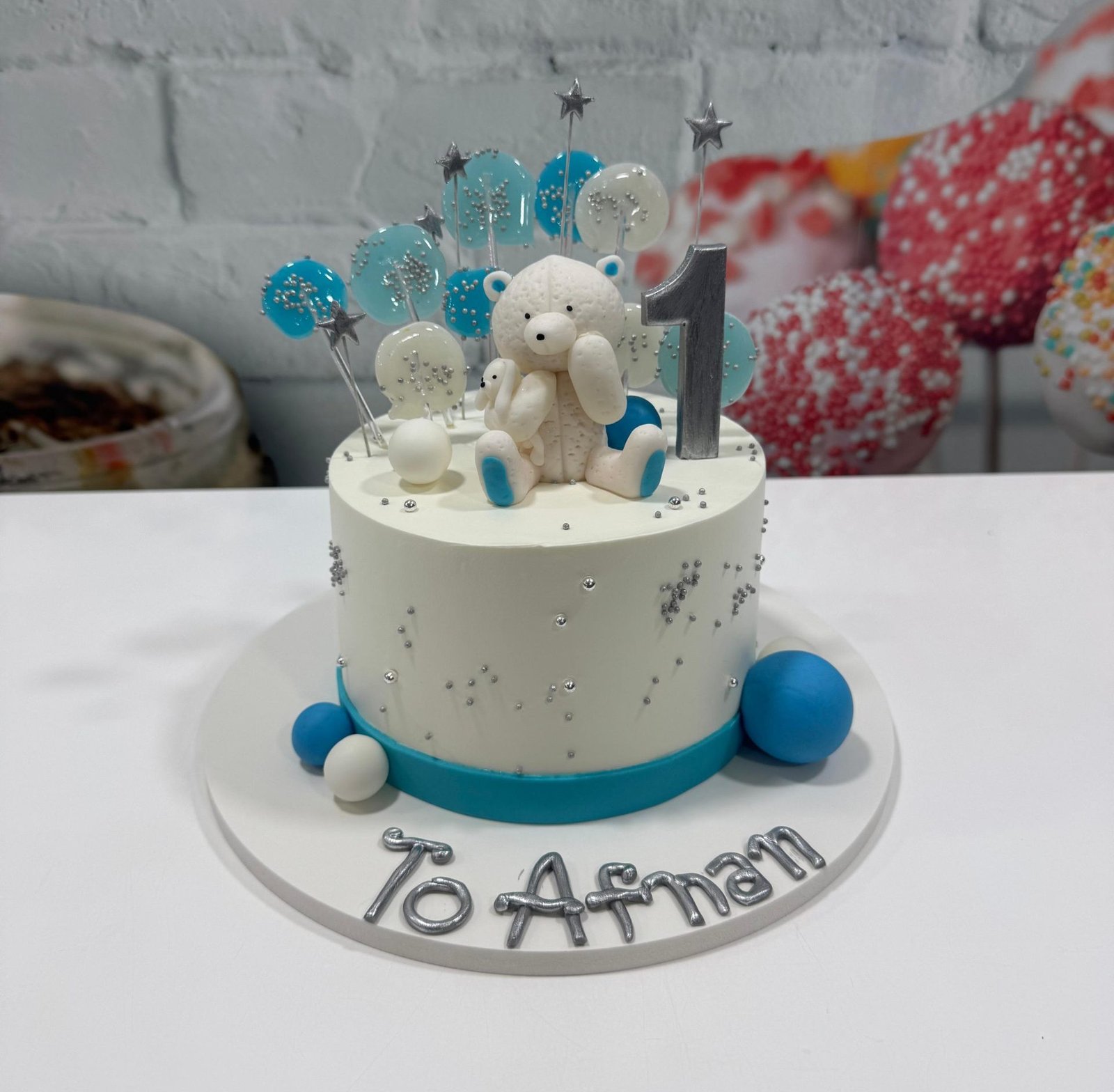 white and blue teddy bear cake